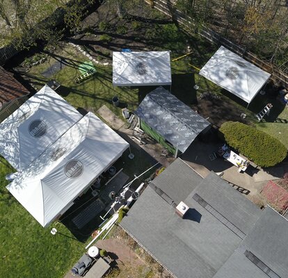 DeBlois Renovate OverheadView Bird's eye view of DeBlois Renovate and Remodel work site, with four Mastertents set up.