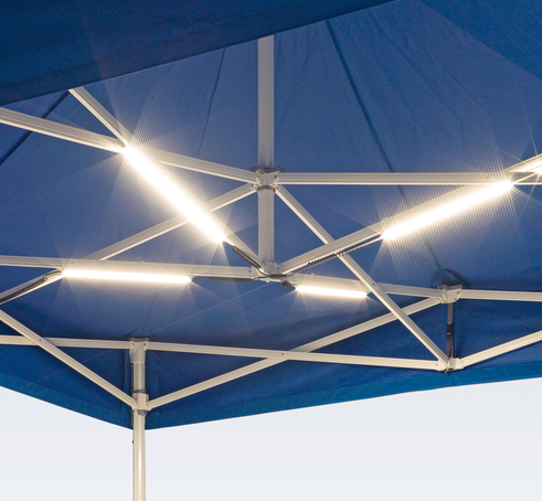 LED lighting system mounted on the internal trusses of a blue Mastertent event tent.