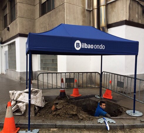 A 10x5ft custom industrial, heavy-duty tent sits on a construction site. 