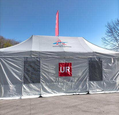 A custom medical tent or fire engine tent with removable signage