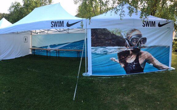 White folding gazebos Nike modular system, 6x4m, 4x4m  with customised side walls with Nike Swim logo and sublimation print