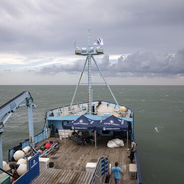 Two Mastertent canopy tents on the deck of a large Ocearch company boat going out to sea.