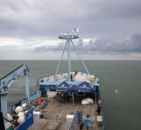 Two Mastertent canopy tents on the deck of a large Ocearch company boat going out to sea.