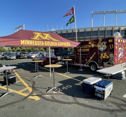 A tailgate tent by Mastertent branded for the Minnesota Golden Gophers.