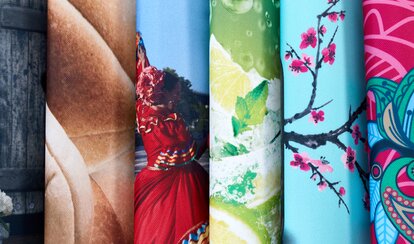Close up of six printed pieces of fabric curved and stacked horizontally