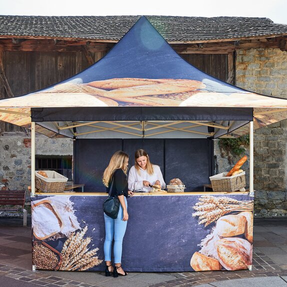 A 4-Awning Mastertent Canopy Tent designed to sell bread at a market.