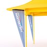 Closeup of left half of a yellow canopy tent coming from the right side of image on a white studio background. Blue triangular flags on each corner of the tent. 