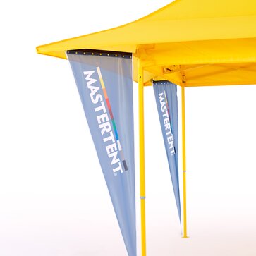 Closeup of left half of a yellow canopy tent coming from the right side of image on a white studio background. Blue triangular flags on each corner of the tent. 