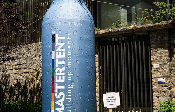 Custom Mastertent branded bottle inflatable at bike race. 