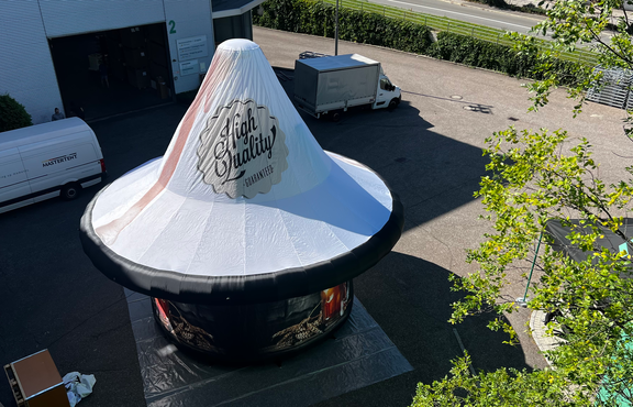Overhead view of custom printed beer pint on Mastertent Tripod inflatable structure.