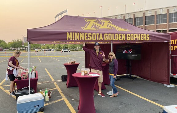 A tailgate tent by Mastertent branded for the Minnesota Golden Gophers.
