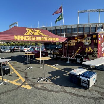 A tailgate tent by Mastertent branded for the Minnesota Golden Gophers.