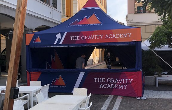 A custom 17x17 tent for a mountain biking team with sidewalls and a fully custom windows created by our in-house manufacturing team. 