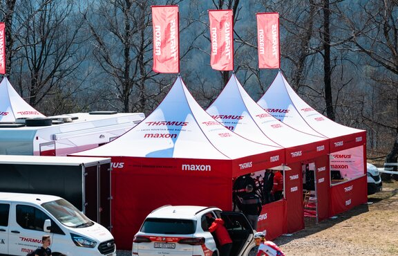 3 custom 17x17 mountain biking team tents with peak flags and custom sidewalls.   