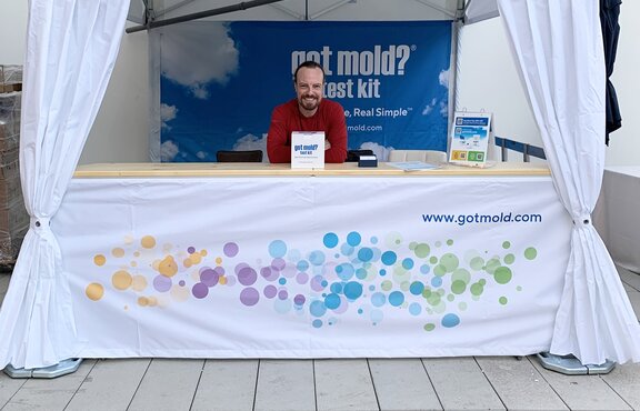 A custom canopy tent with tent curtains, a counter, base weights and sidewalls. 