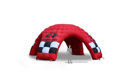 An inflatable event tent in red with logo print "CAR RACING" on white background. For size comparison, the outline of a person was inserted under the inflatable advertising media.