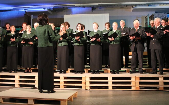 The church choir of St. Martin in Thurn is standing on wooden pallets providing musical entertainment.
