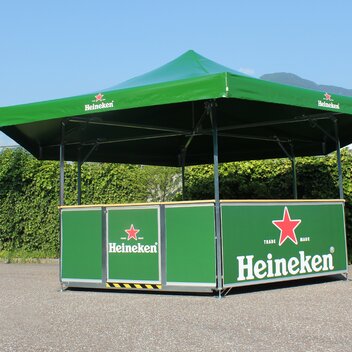 Green hexagon pavilion for Heineken. The beer pavilion is located on a square. 