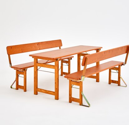 Wooden beer tent furniture, with wooden legs and two benches with backrest.