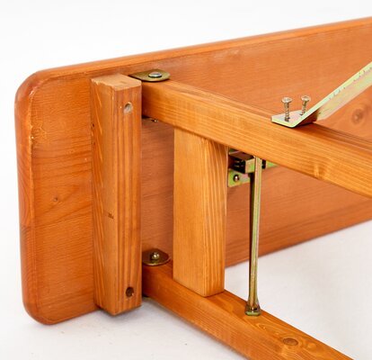 Detailed view of a wooden beer bench. The beer bench is displayed from below. 