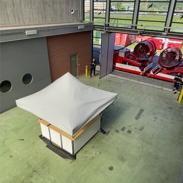 The stability of the square pavilion is tested in the wind tunnel.