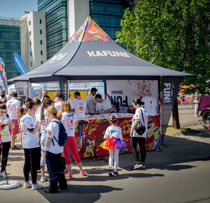 Printed gazebo with awning at a sports event. The gazebo stands in the middle of the crowd. 