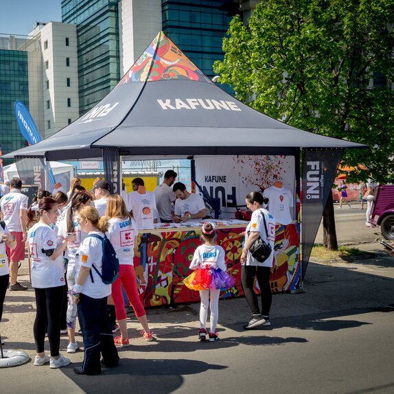 Printed gazebo with awning at a sports event. The gazebo stands in the middle of the crowd. 