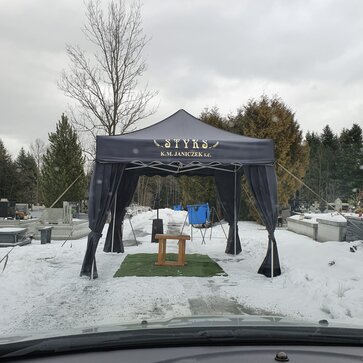 A black canopy tent for funerals.
