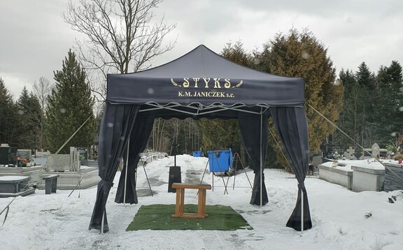 A black canopy tent for funerals.