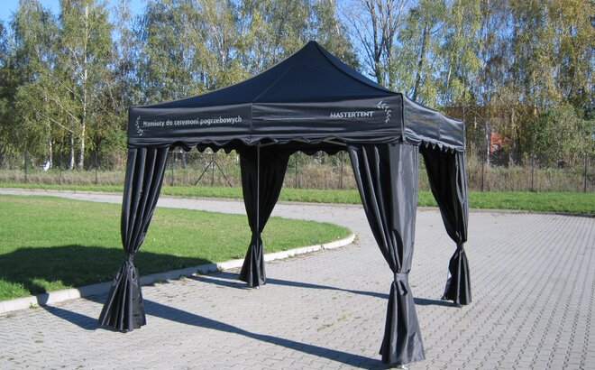 A black canopy tent for funerals.