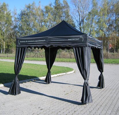 A black canopy tent for funerals.