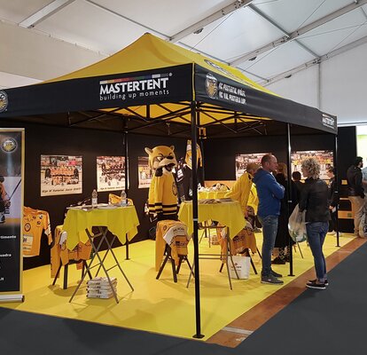 Gazebo 6x3 for trade fair. Yellow and black gazebo customised with HC Pustertal team logo.  