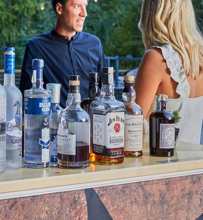 Various drinks are available at the counter of the beverage stand.