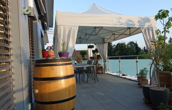 Folding tent on the balcony or a roof terrace.