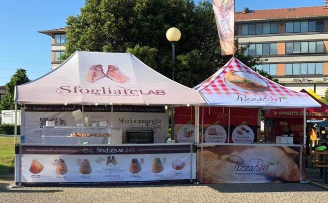 A Street Food Stand with two gazebos with awnings and a roof flag. Both gazebos are full-surface printed. 