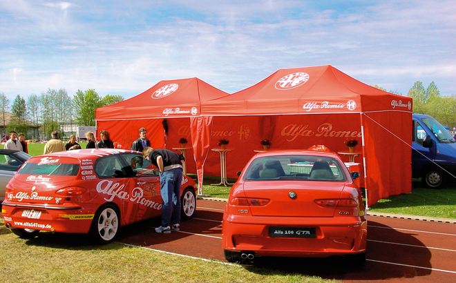 Folding gazebo 4.5x3 m red customised with logo and full side walls used for Alfa Romeo car event.