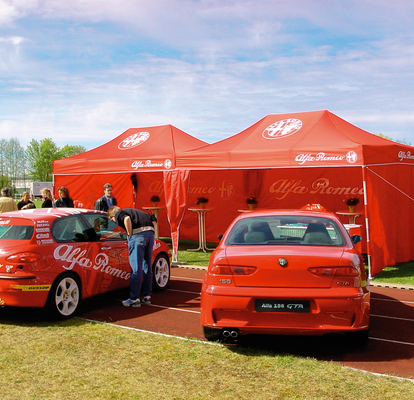 Folding gazebo 4.5x3 m red customised with logo and full side walls used for Alfa Romeo car event.