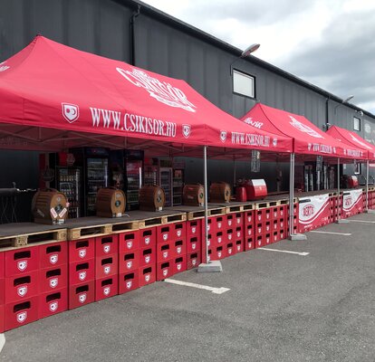 Red folding gazebo 8x4  with Csikisor logo for beer sale at outdoor event