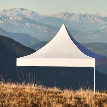 A white pagoda tent is placed in the sunset at the Plose mountain. 