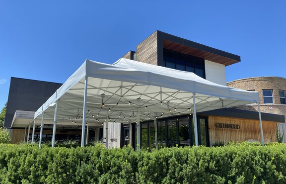 A white Gazebo stands in front of the Greenwood restaurant in the United States. 