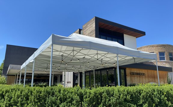 A white Gazebo stands in front of the Greenwood restaurant in the United States. 