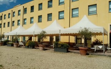 The pagoda tents serve as terrace canopies in front of the Hotel Barrage. 