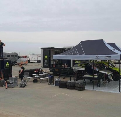 two race gazebo at the Dakar rally 2022 with race car and Arcane van