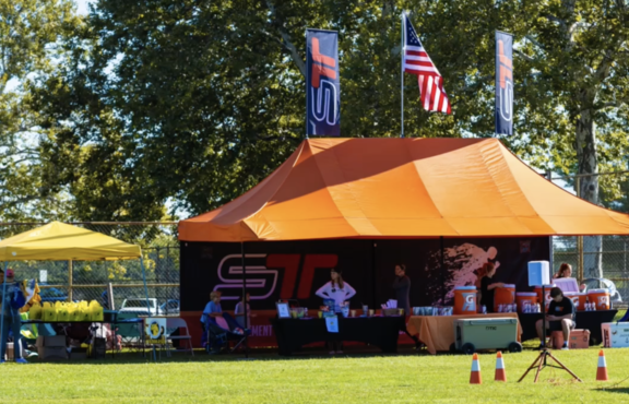 Orange sport-tent in a park during the Smarter Team Training event in the US