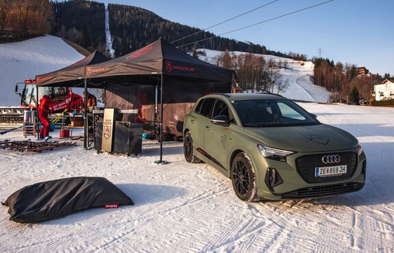 Van Deer Red Bull Ski Sports promotion event on snow-covered ski slope with snowcat under cable car with 2 3x3 m Mastertent folding pavilions for service and equipment and Audi advertising vehicle | © Sebastian Hoellwart