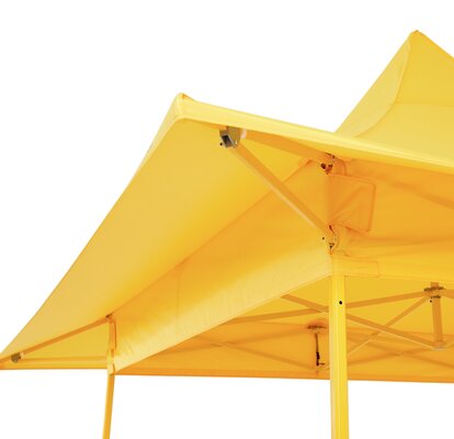 Yellow gazebo with awning. The yellow awning and the yellow structure are visible from below. 