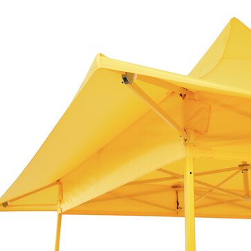 Yellow gazebo with awning. The yellow awning and the yellow structure are visible from below. 
