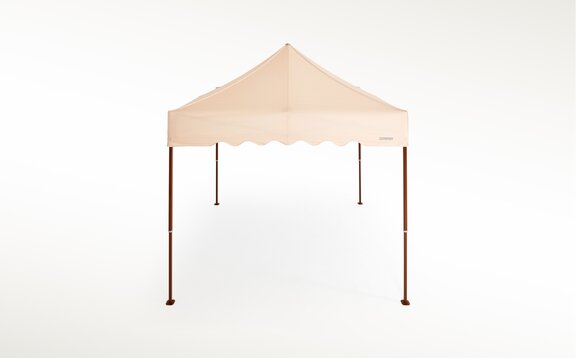 Ecru gazebo with brown structure and scalloped valance. 