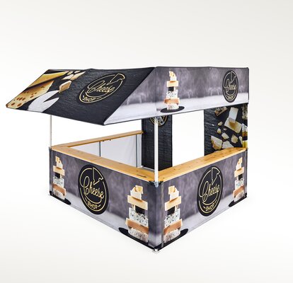 The gazebo with flat roof has a canopy. The counter is used for selling cheese. The entire gazebo is printed.