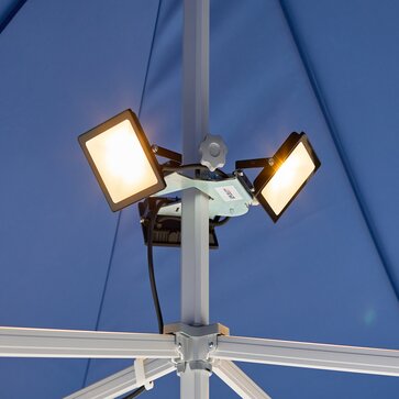 Three LED spotlights are mounted on the blue gazebo. The LED spotlights are all on.